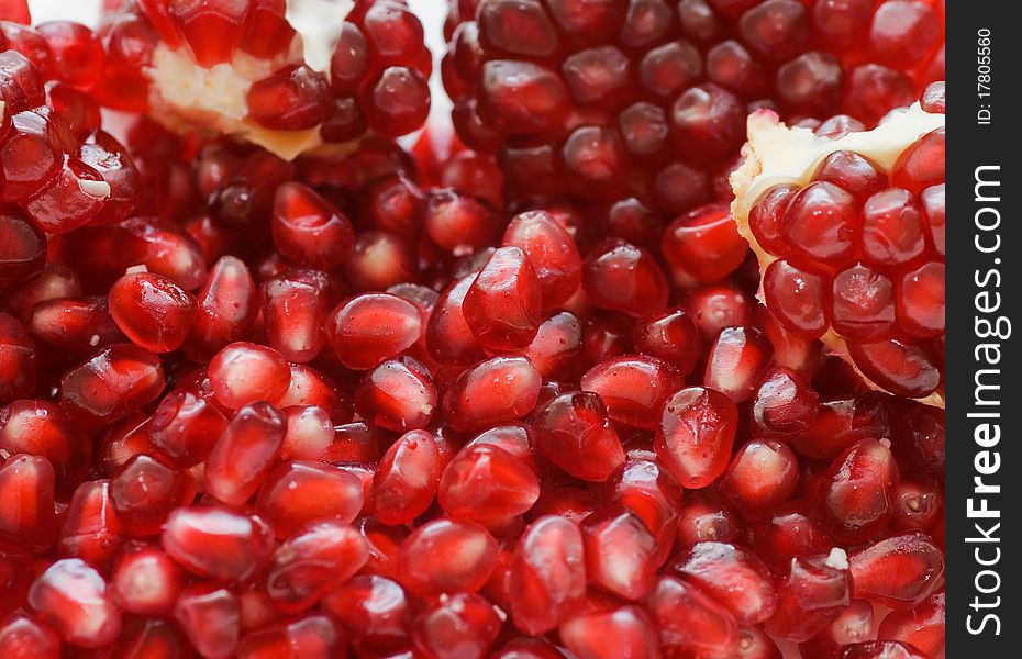 Macro of peeled ripe seeds pomegranate close up