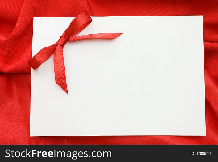 Pure sheet papers on a red fabric still life