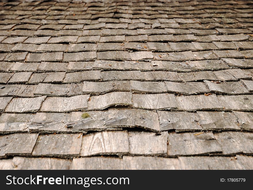 Old shingle roof is photographed closely. Old shingle roof is photographed closely.