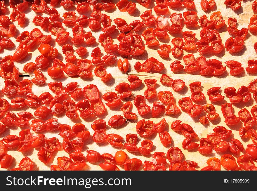 Dry tomatoes with salt under the sun