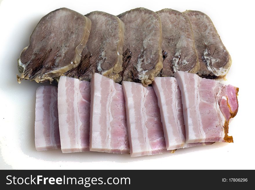 Meat cutting beef tongue and bacon isolated