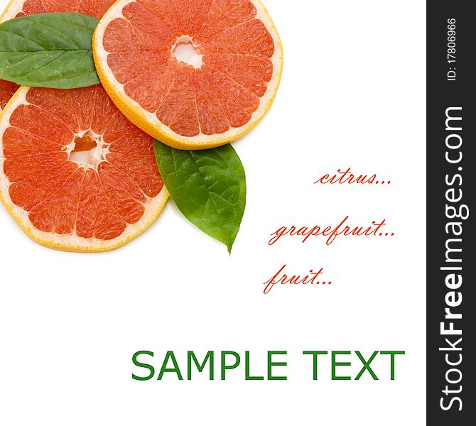 Fresh juicy grapefruits and green leafs