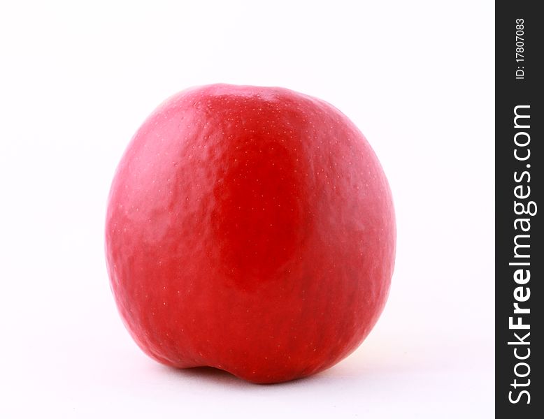 Close-up of juicy ripe red apple isolated on white