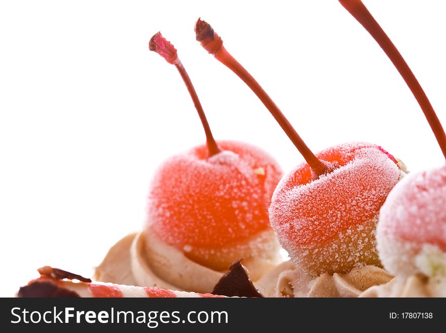 Red cherries on top of cake. Red cherries on top of cake