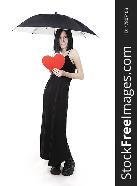 Young lady in black dress protects her heart