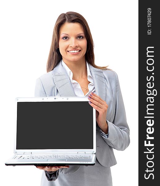 Pretty business woman looking at laptop