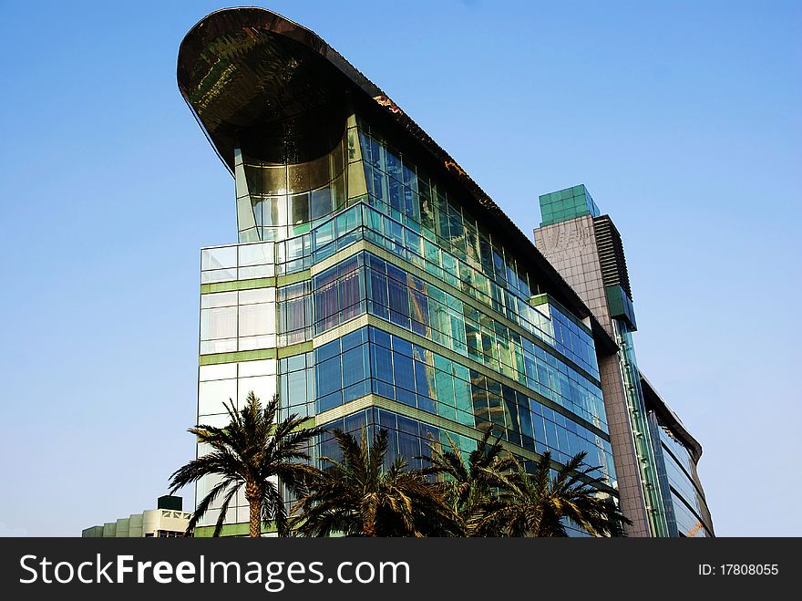 glass building isolated in blue sky