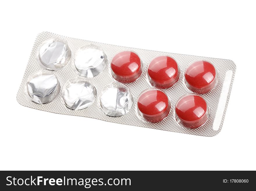 Red pills isolated on white background