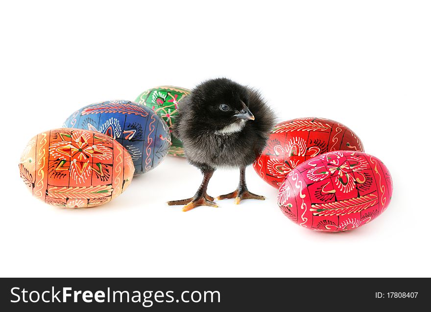 Cute baby-chicken and colorful Easter eggs isolated on white background. Cute baby-chicken and colorful Easter eggs isolated on white background