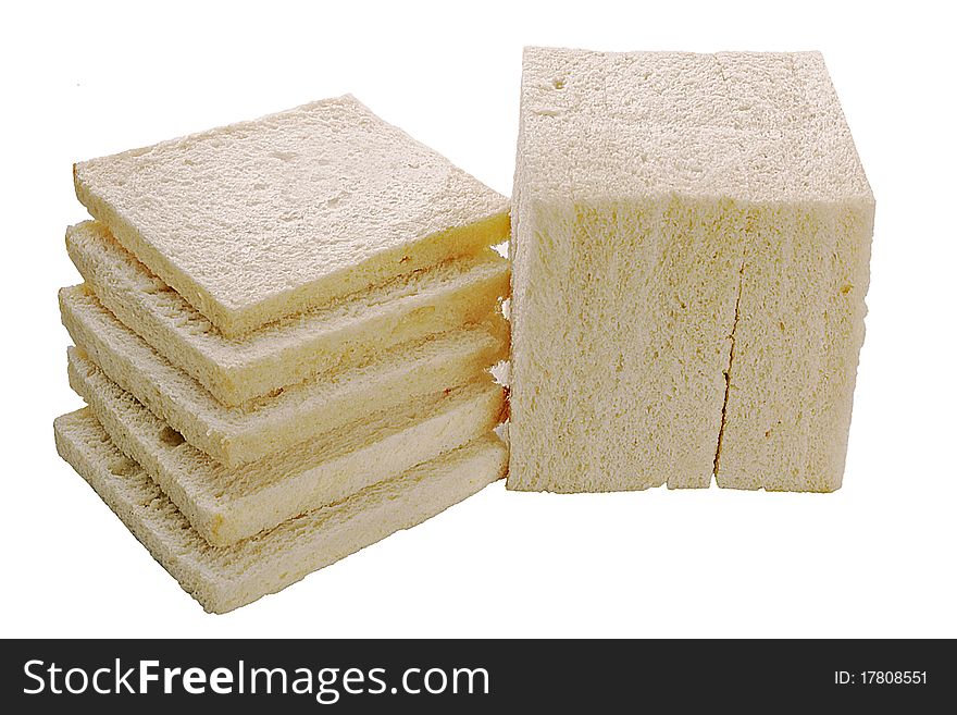 A stone-ground loaf of white bread sliced