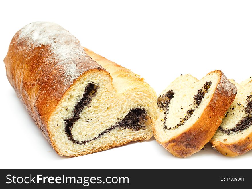 Home-baked roll with poppy seeds and raisins isolated on white