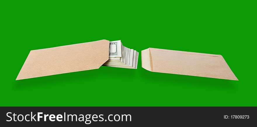 Two paper bags and dollars isolated on the green background with clipping paths. Two paper bags and dollars isolated on the green background with clipping paths.