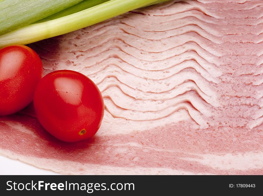 Raw bacon, cut thin slices, without packaging.