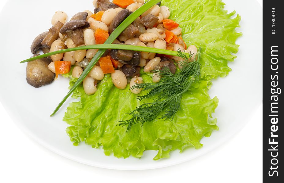 Warm salad of beans and fried mushrooms on white