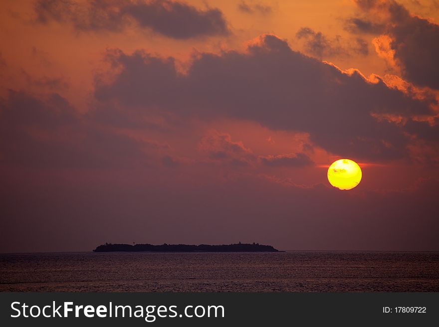 Beautiful sunset in Maldives on the ocean.