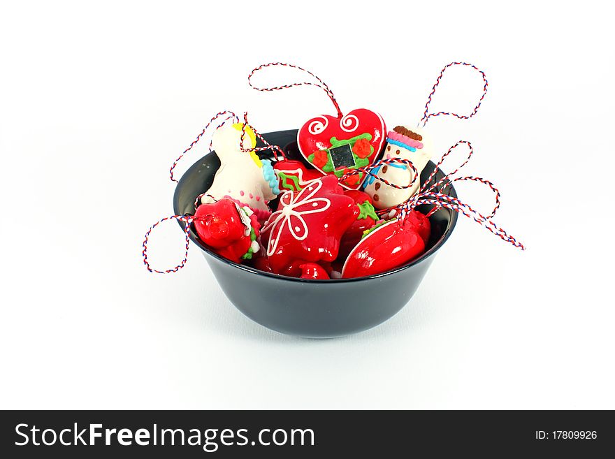 Little Licitar cookies in black bowl isolated on white decoration for Christmas