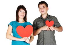 Girl And Man Holding Two Paper Hearts, Smiling Stock Image Girl And Man Holding Two Paper Hearts, Smiling Stock Image