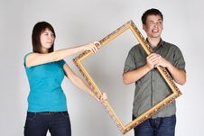 Woman Wresting Frame From Man, Angry Faces Stock Photos Woman Wresting Frame From Man, Angry Faces Stock Photos