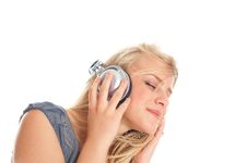 Young Lady Listening To Music On Headphones Royalty Free Stock Photography Young Lady Listening To Music On Headphones Royalty Free Stock Photography