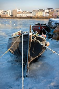 Boats In Ice On The Bank Of River Royalty Free Stock Photography Boats In Ice On The Bank Of River Royalty Free Stock Photography