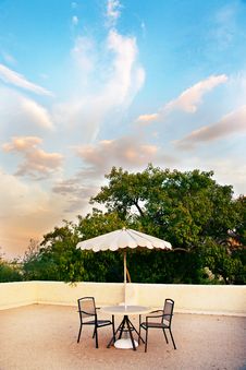 Table, Chairs And Umbrella For Rooftop Relaxation Royalty Free Stock Photography Table, Chairs And Umbrella For Rooftop Relaxation Royalty Free Stock Photography