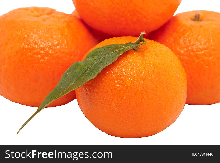 Fresh juicy oranges with leafs. Isolated on white background