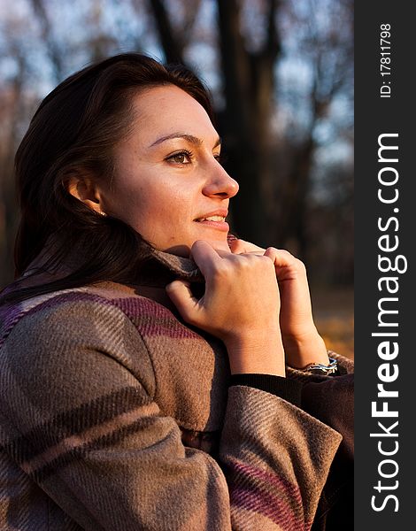 Beautiful young woman on a bench in autumn. Beautiful young woman on a bench in autumn