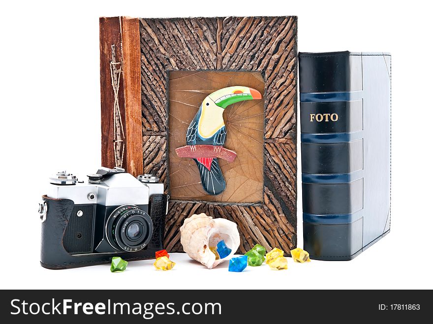 Vintage camera and photo album with empty picture. Isolated on white