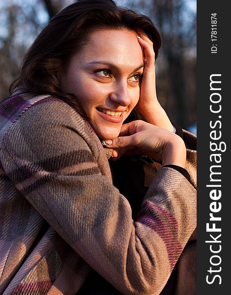 Beautiful young woman on a bench in autumn. Beautiful young woman on a bench in autumn