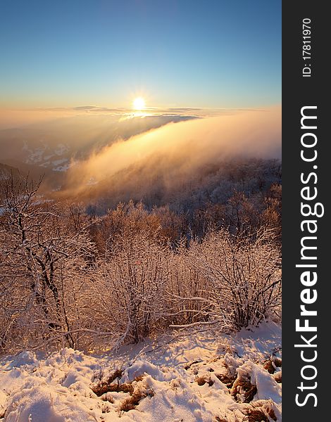 A frosty sunset panorama in beauty winter mountains. A frosty sunset panorama in beauty winter mountains