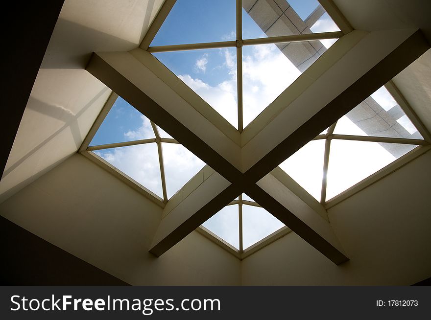 Cross ceiling windows with blue sky