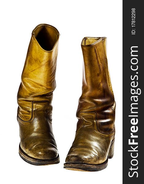 Old worn cowboy style boots from the seventies of the twentieth century - isolated