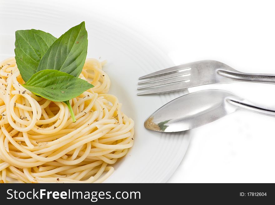 Spaghetti in plate with fork and spoon. Spaghetti in plate with fork and spoon