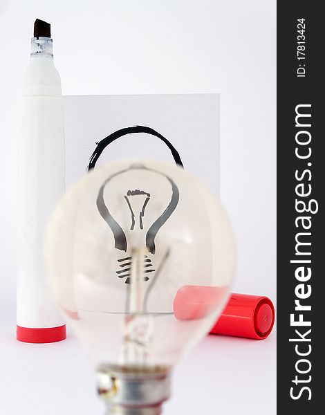 Real light bulb and illustration light bulb focus with drawing pen. Real light bulb and illustration light bulb focus with drawing pen