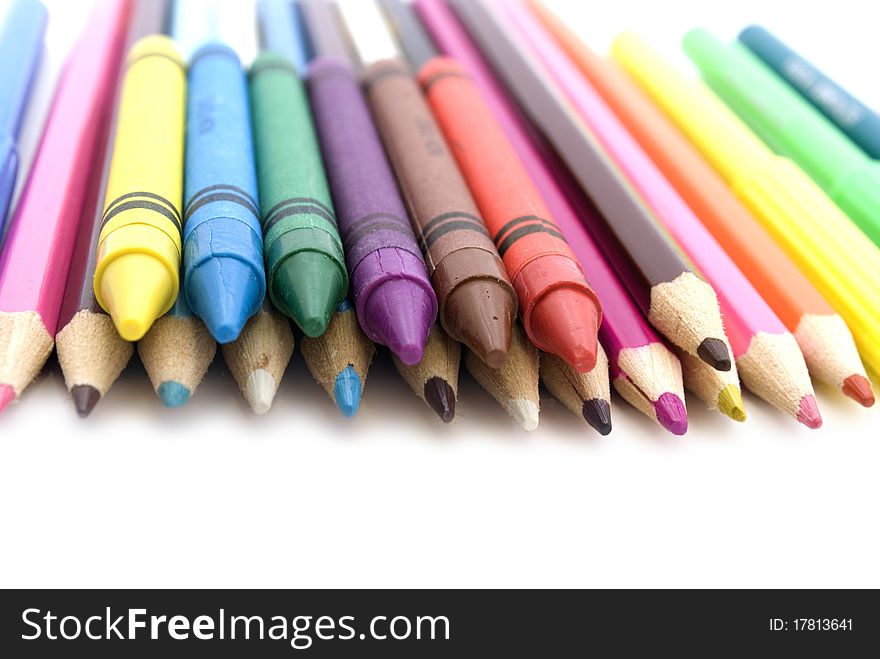 colored pencils and markers isolated on white