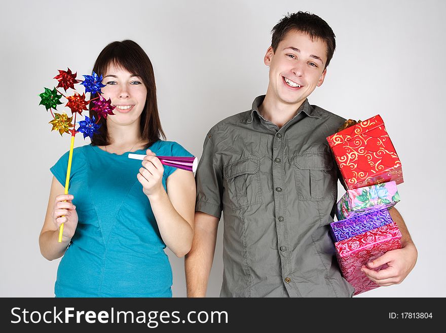 Man and girl holding many gifts and smiling