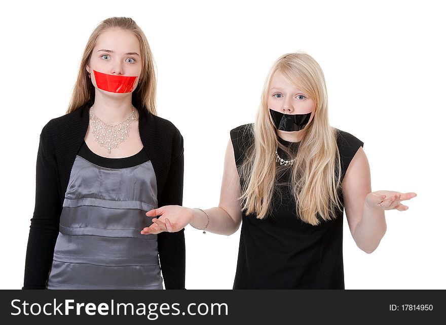 Two beautiful girls with their mouths taped with tape