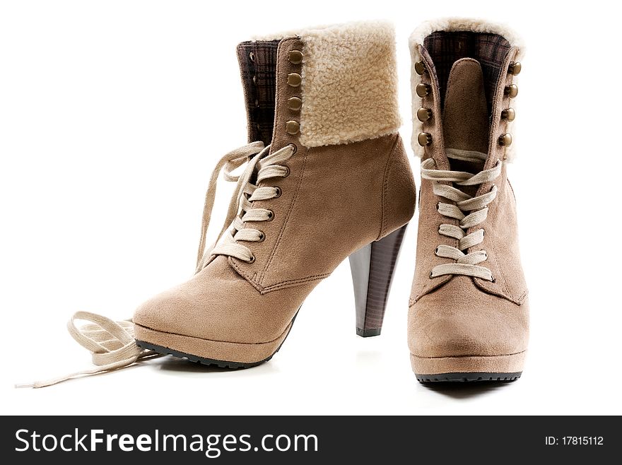 Pair of beige women's shoes with fur on the heel. Pair of beige women's shoes with fur on the heel