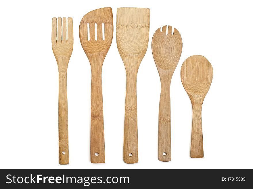 Set of wooden kitchen utensils it is isolated on a white background