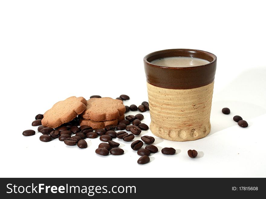 Coffee beans, gingerbread & coffee mug isolated on white background