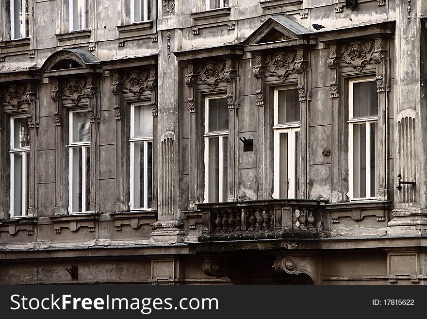 Old house grey facade detail with the balcony