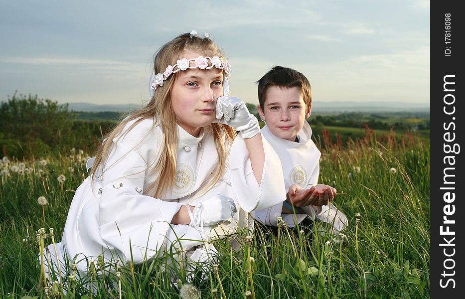 Girl in first holy communion on landscape. Girl in first holy communion on landscape