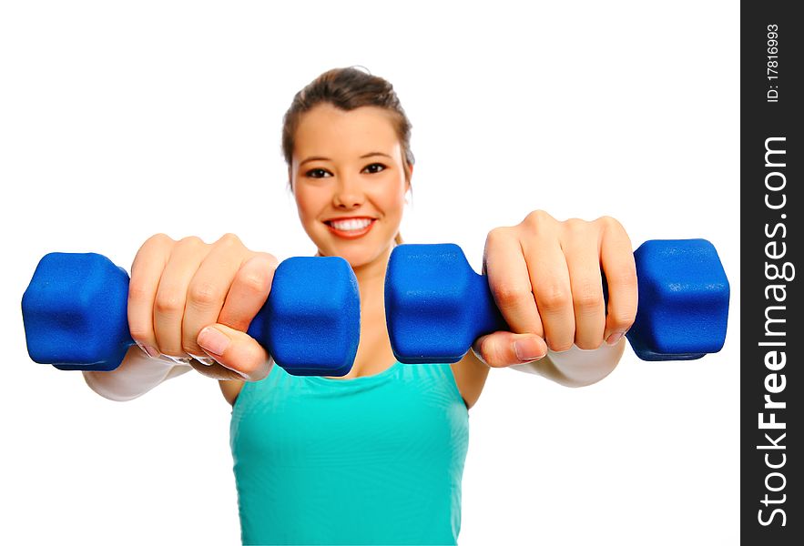 Young attractive woman trains and tones with weights, isolated on white. Young attractive woman trains and tones with weights, isolated on white