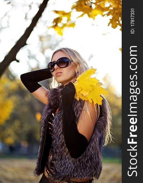 Beautiful woman portrait in natural autumn