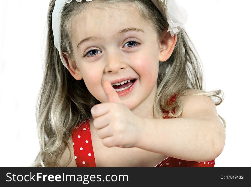 Close-up of a little Girl showing thumbs up, white Background. Close-up of a little Girl showing thumbs up, white Background