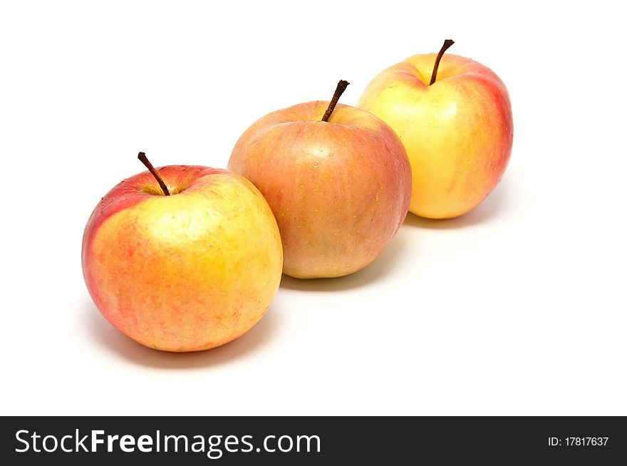 Ripe juicy apples on a white background