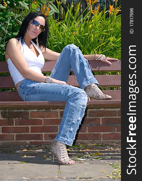 Image showing beautiful young female relaxing outdoors in the sun. Image showing beautiful young female relaxing outdoors in the sun