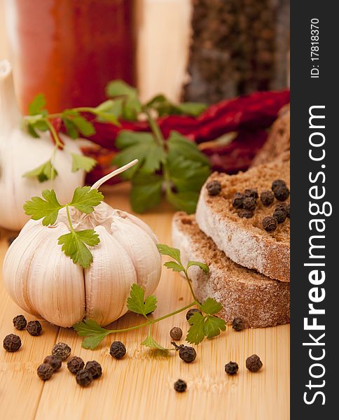 Garlic and pepper with other spices on the kitchen table