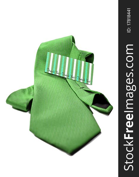 Green tie with a thank you card for the man in your life, isolated on a white background. Green tie with a thank you card for the man in your life, isolated on a white background
