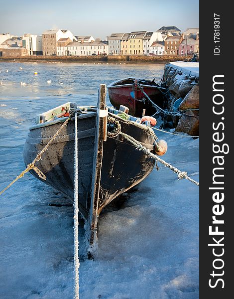 Boats In Ice On The Bank Of River